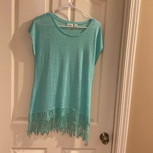 Cato green top. Sleeveless 57% rayon 43% polyester. Fringes on bottom